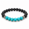Bracelet Turquoise en pierres turquoise et lave noire avec séparateurs argentés sur fond blanc