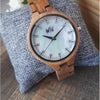 WILD CLOUD ZW10 – Women's olive wood watch on a cushion with pearly white dial